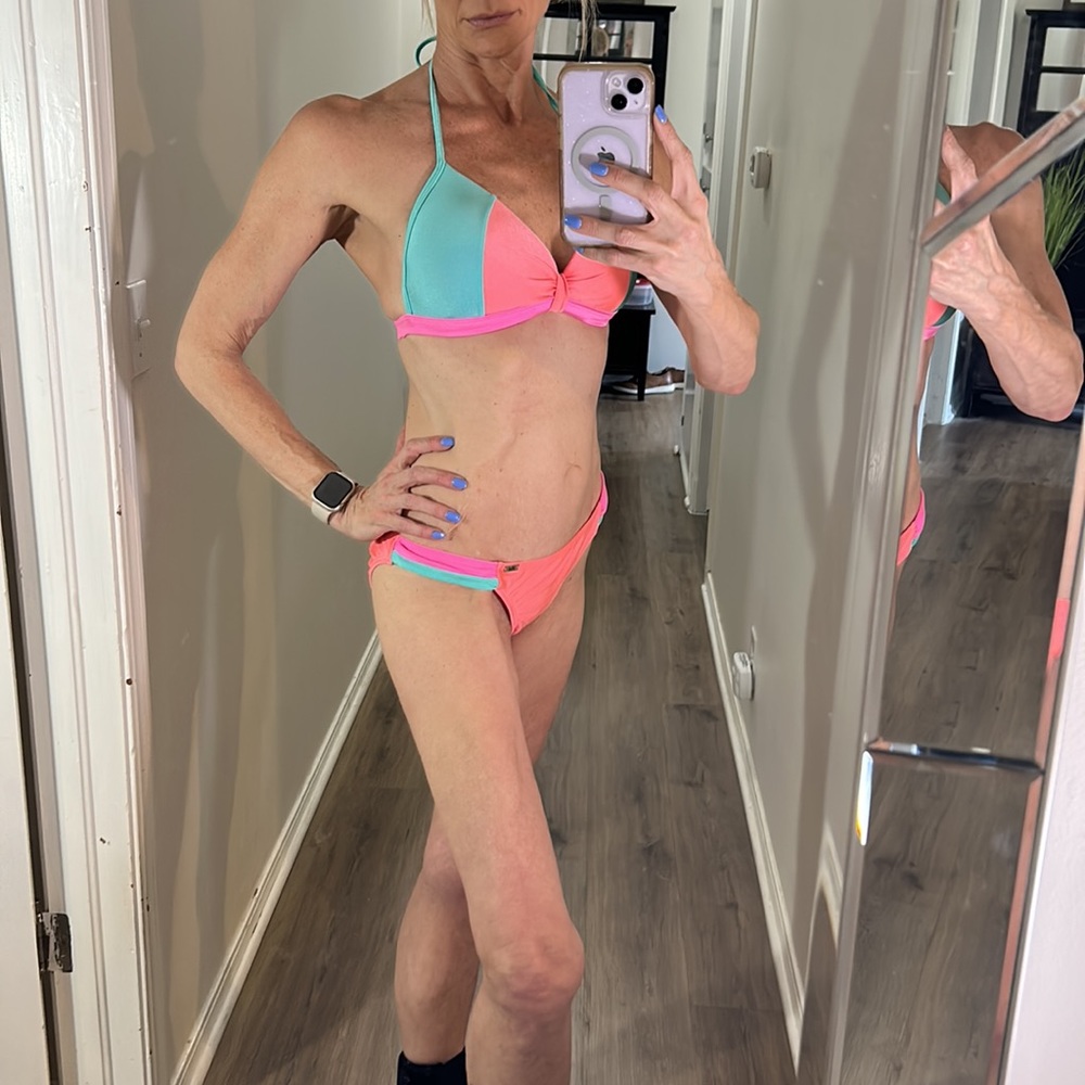 HEAT 2 piece Bikini with halter tie and padded top. Hook back closure. Size L